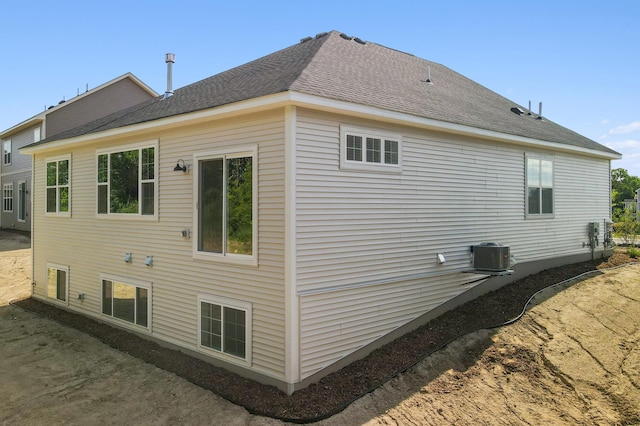 view of property exterior with central AC unit