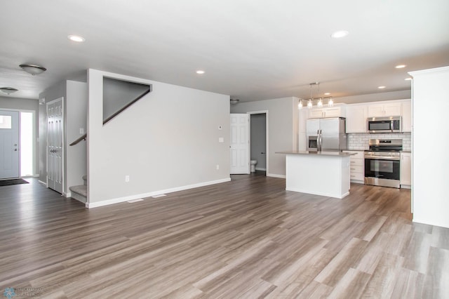 unfurnished living room featuring light hardwood / wood-style flooring