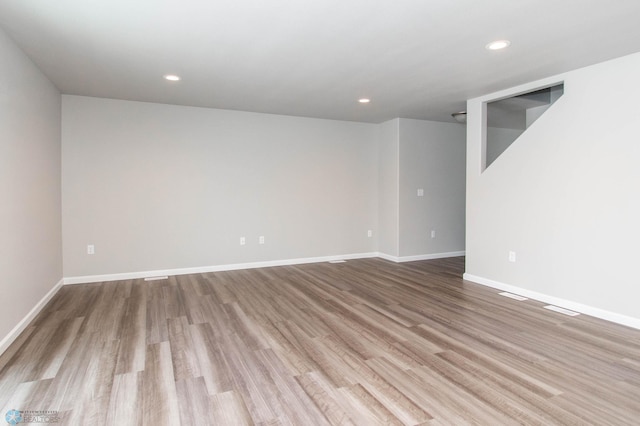 spare room featuring light wood-type flooring