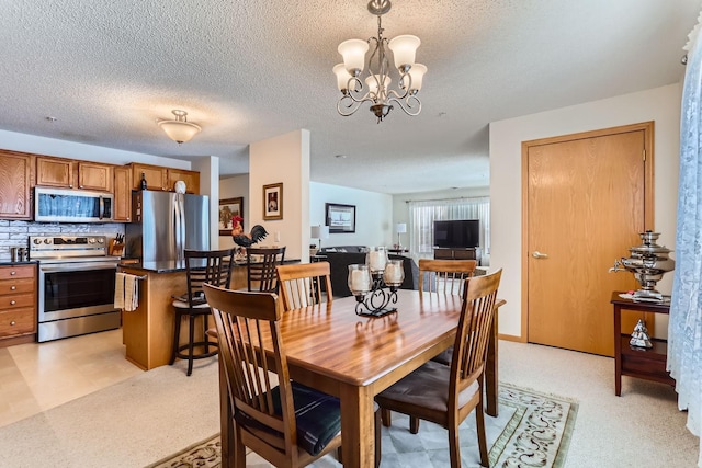 dining area featuring a chandelier