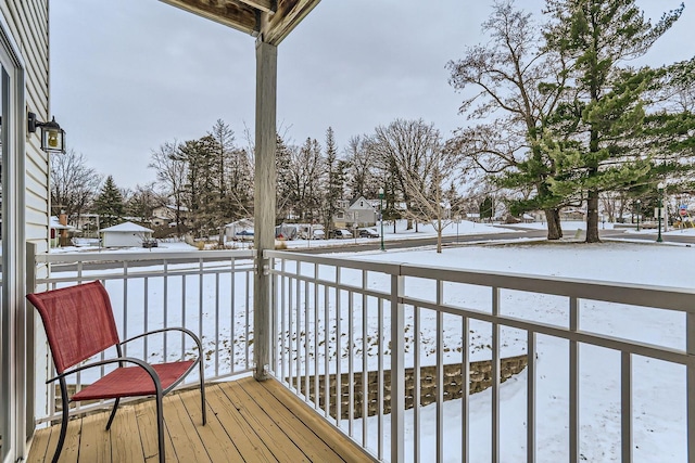 view of snow covered deck