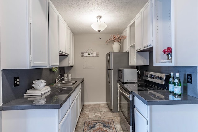 kitchen featuring decorative backsplash, sink, white cabinets, and stainless steel appliances