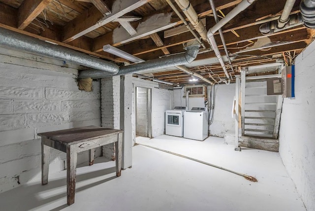 unfinished basement with washing machine and dryer