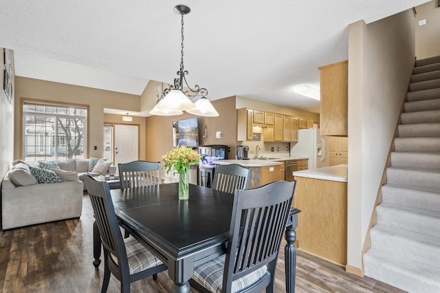 dining area with sink and dark hardwood / wood-style floors