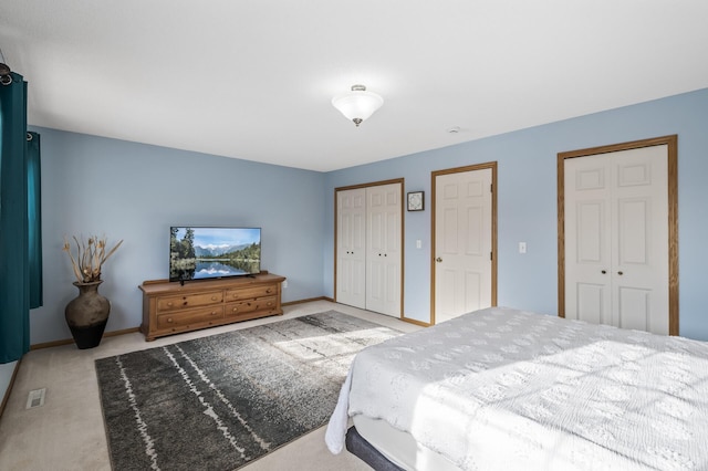 bedroom with light carpet and a closet