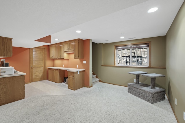 kitchen featuring light colored carpet