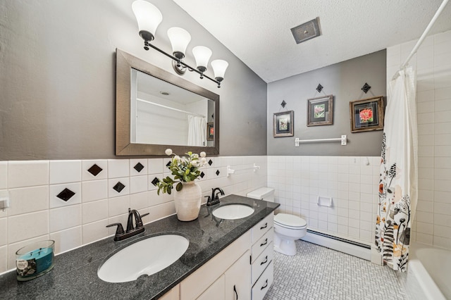 full bathroom featuring shower / bath combo, tile walls, a baseboard heating unit, a textured ceiling, and toilet