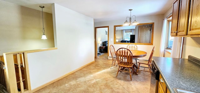 dining area featuring a notable chandelier