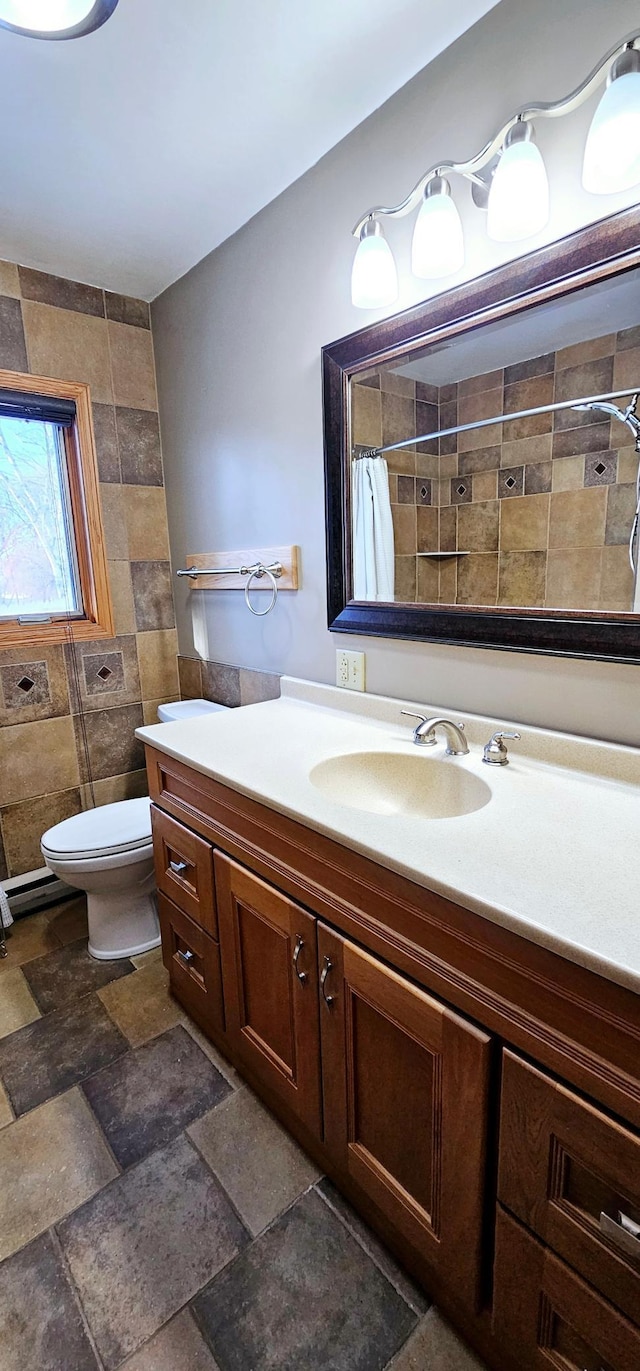 bathroom featuring vanity, toilet, and walk in shower