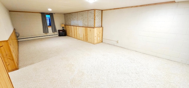 basement with light carpet and a baseboard heating unit