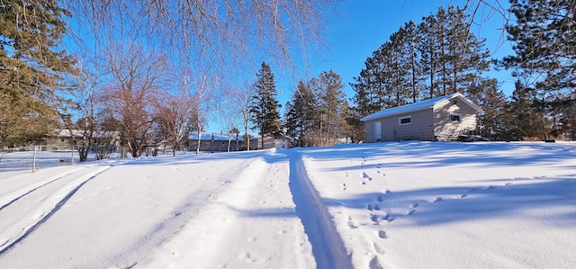 view of yard layered in snow