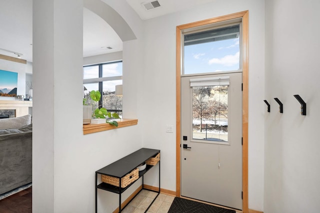 entryway featuring light tile patterned floors