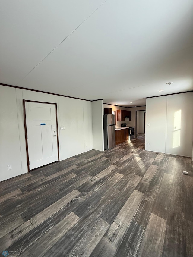 unfurnished living room with dark hardwood / wood-style flooring