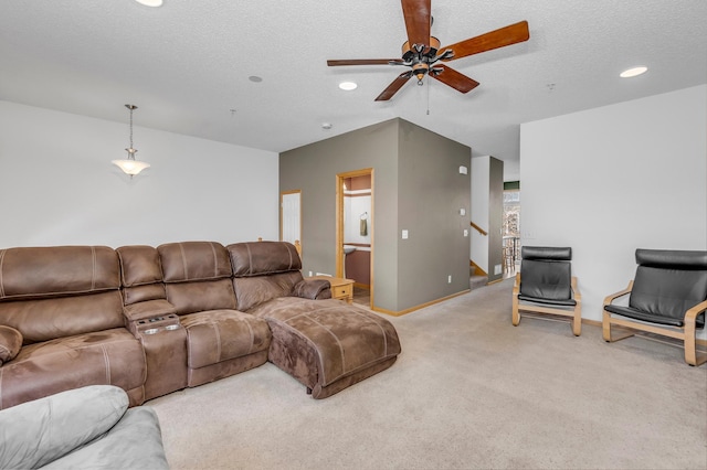 living area featuring a textured ceiling, recessed lighting, light carpet, baseboards, and stairway