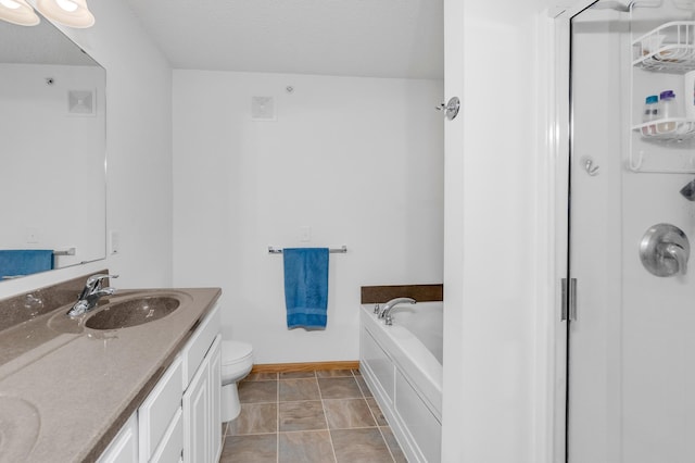 full bath with a garden tub, toilet, a sink, baseboards, and double vanity