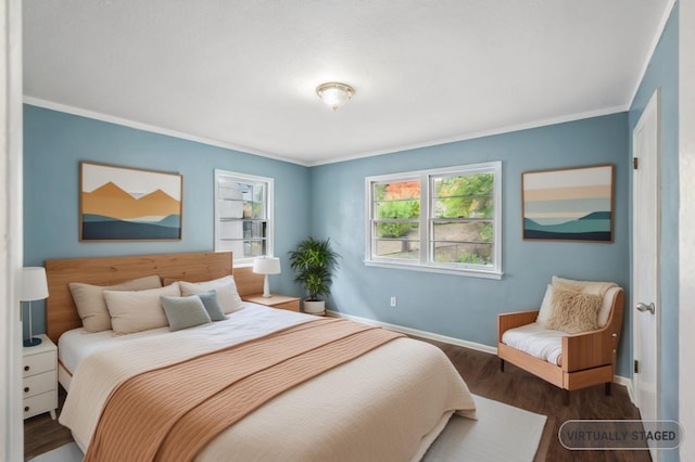 bedroom with dark wood-type flooring and ornamental molding