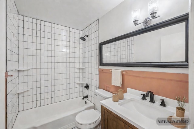 full bathroom with toilet, tiled shower / bath combo, and vanity