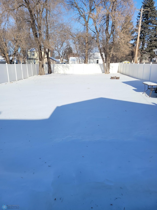 view of yard covered in snow