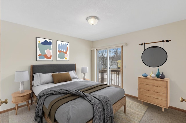 bedroom featuring access to exterior and carpet