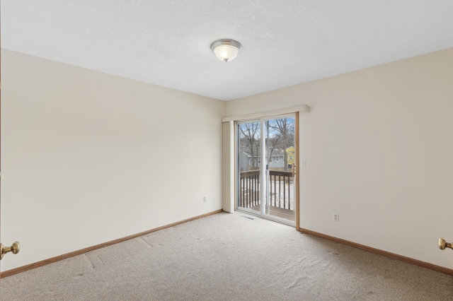 unfurnished room with carpet flooring