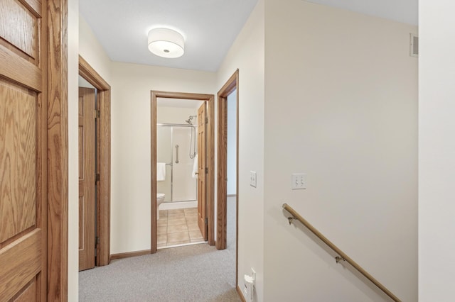 hallway with light colored carpet