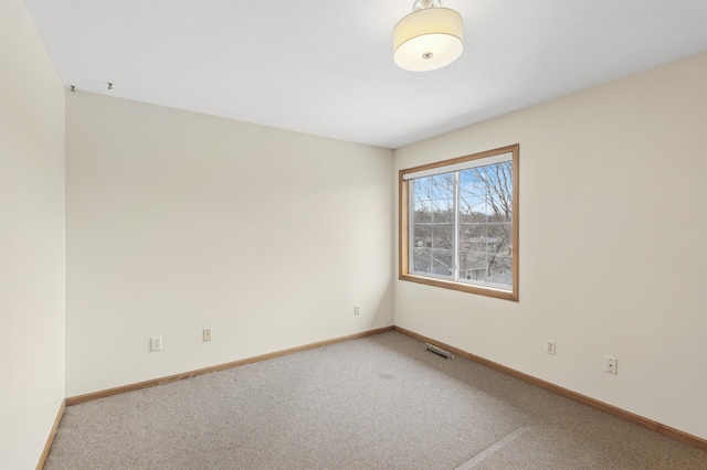 empty room featuring carpet floors