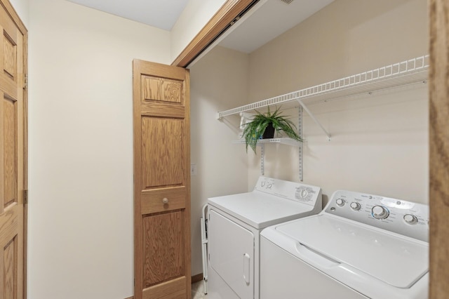 laundry room with independent washer and dryer