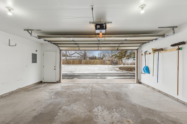 garage featuring a garage door opener and electric panel