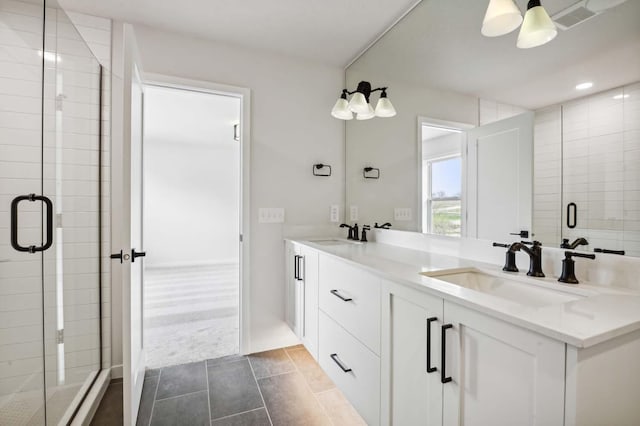 bathroom featuring an enclosed shower, vanity, ceiling fan, and tile patterned flooring