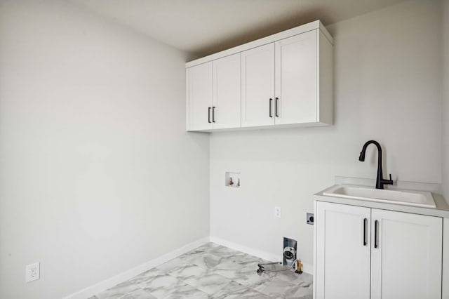 laundry area featuring sink, hookup for an electric dryer, hookup for a washing machine, and cabinets