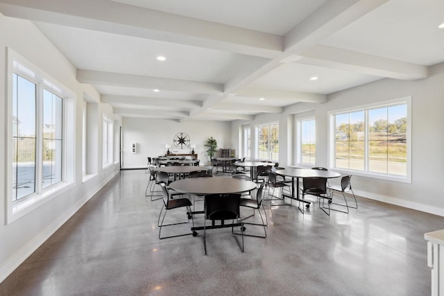 dining room with a healthy amount of sunlight, beamed ceiling, and coffered ceiling