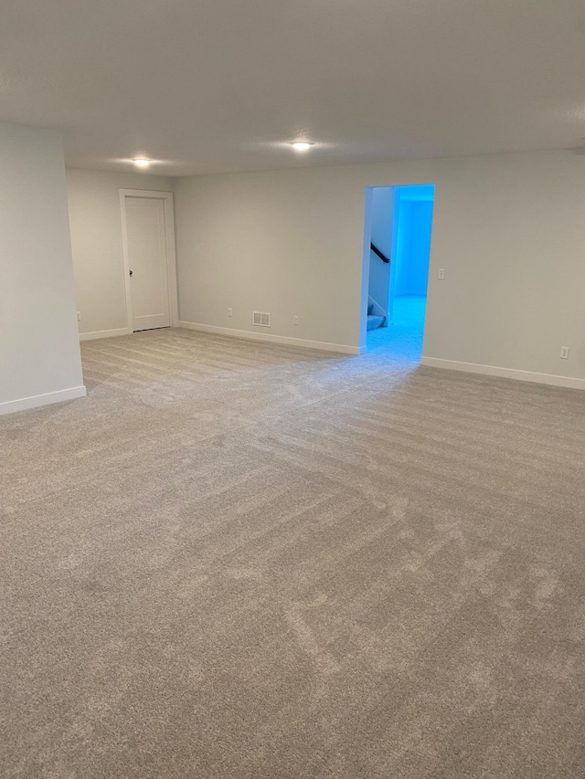 spare room with light carpet