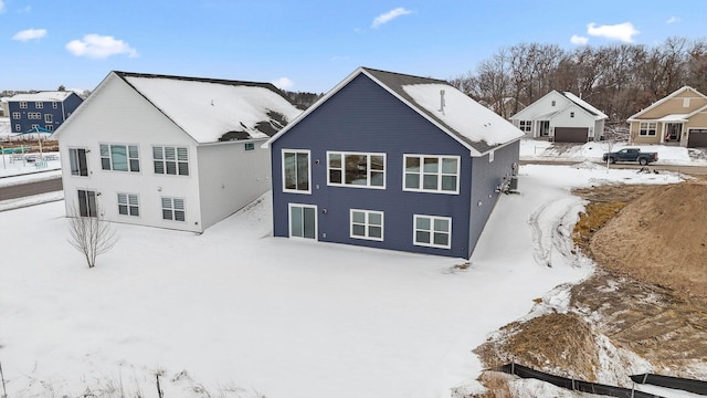 view of snow covered house