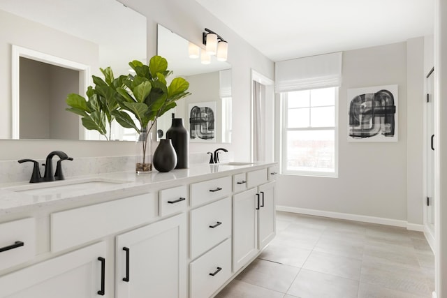 bathroom with vanity and tile patterned flooring