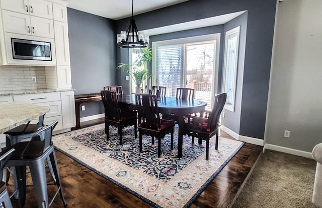 dining room featuring a notable chandelier