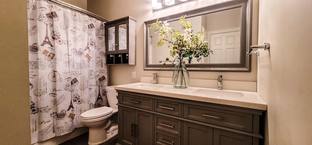 bathroom featuring a shower with curtain, toilet, and vanity