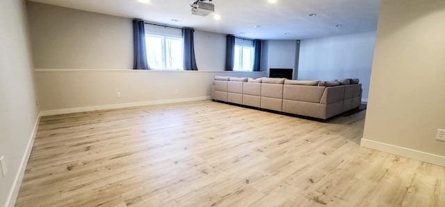 unfurnished living room featuring light wood-type flooring