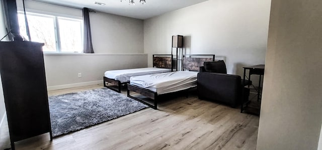 bedroom with light hardwood / wood-style floors