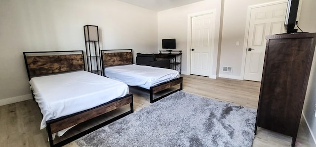 bedroom with light hardwood / wood-style floors