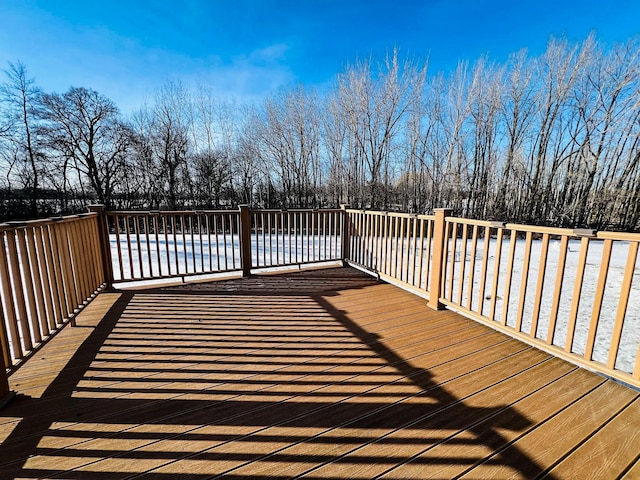 wooden deck featuring a swimming pool