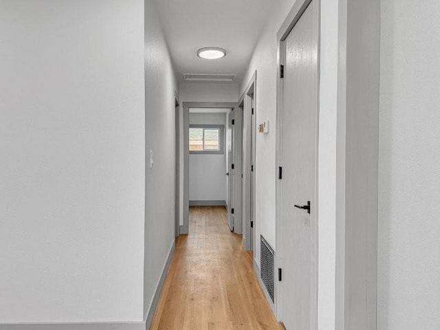 corridor featuring light hardwood / wood-style flooring