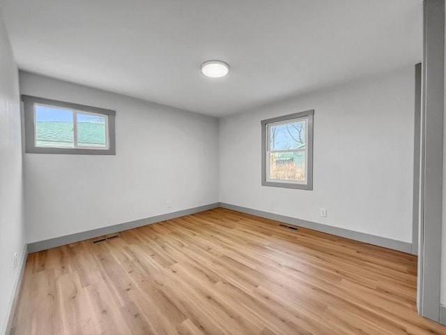 unfurnished room with light hardwood / wood-style floors