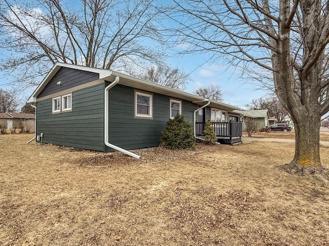 view of home's exterior featuring a deck