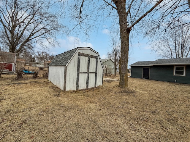 view of outbuilding featuring a yard