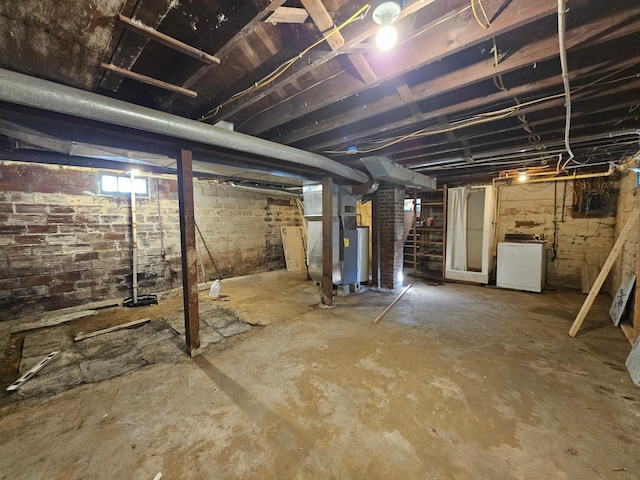 basement with heating unit and washer / clothes dryer