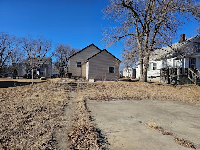 view of side of home featuring a residential view