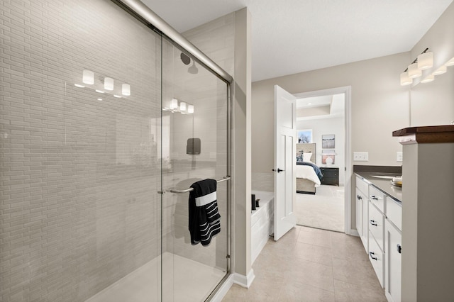 bathroom featuring vanity and a shower with door