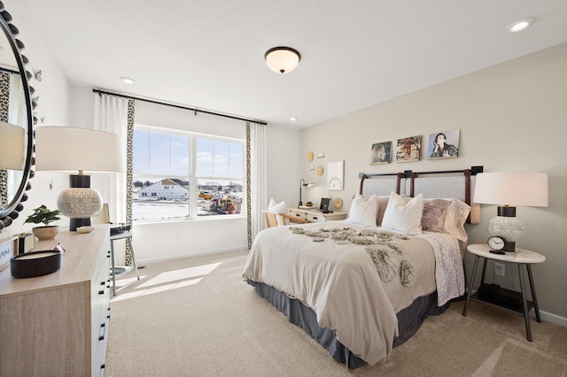 bedroom featuring light carpet