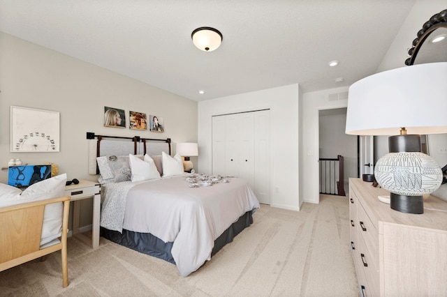 carpeted bedroom with a closet