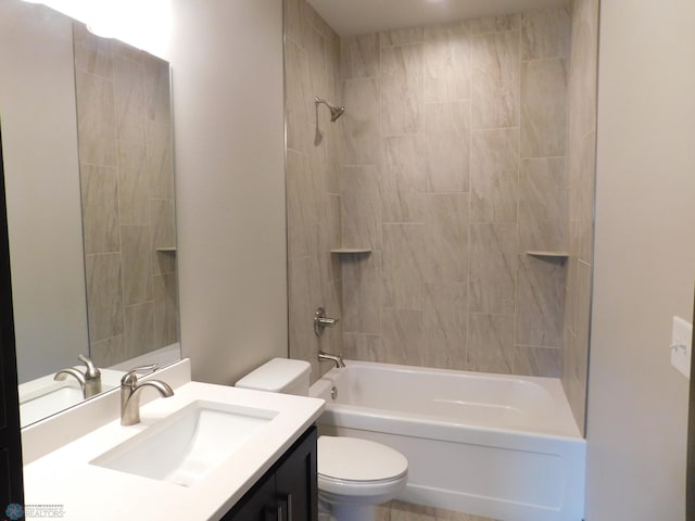 full bathroom with vanity, toilet, and tiled shower / bath combo